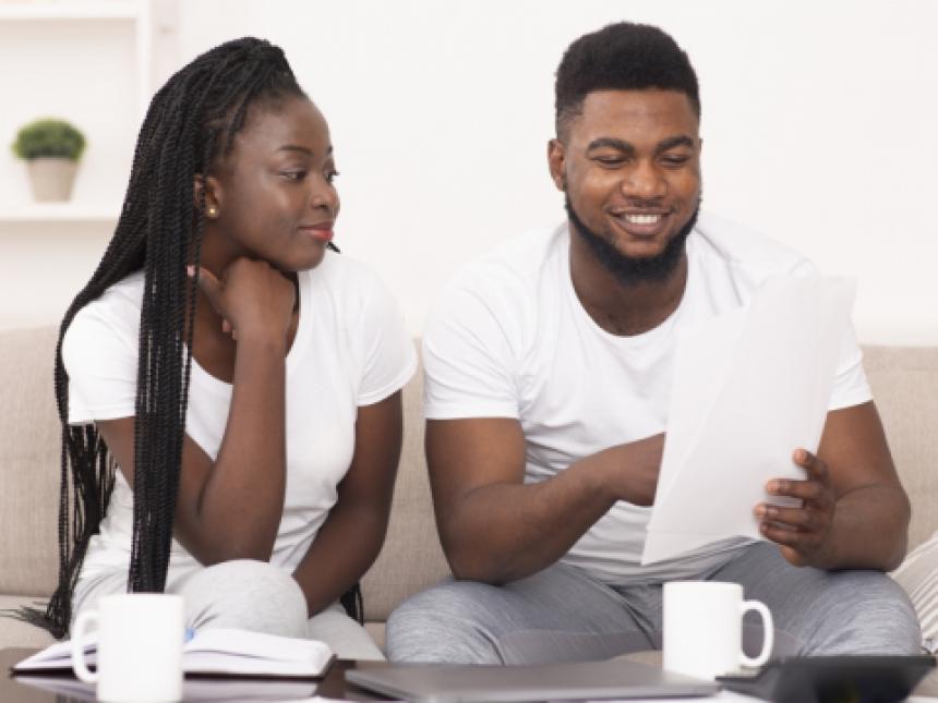 Young couple working on finances.