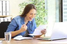 young woman excited about tax refund